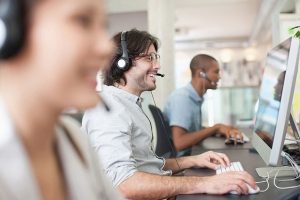 help desk it support people working at their computers